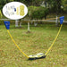 Portable badminton set with net, suitcase kit, and rackets on a grassy outdoor lawn.