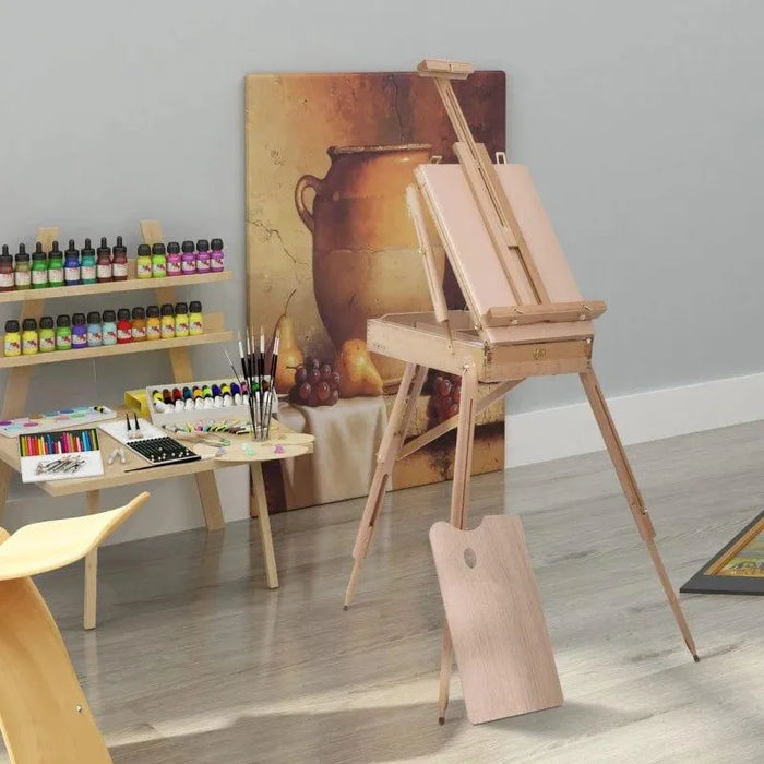 Portable folding wooden easel with adjustable height in art studio setting with painting supplies