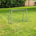 Portable 6ft x 4ft football goal net with metal frame on green lawn outdoors