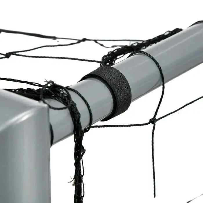 Closeup of heavy-duty grey metal football goal post with black weather-resistant net