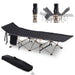 Portable black military folding camping cot with steel frame, side pocket, and carry bag