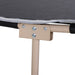 Close-up of portable military camping cot with tan steel frame and black fabric