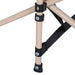 Close-up of steel frame leg and strap connector on black folding camping cot