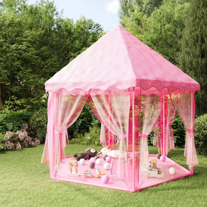 Princess-themed pink play tent and ball pit with toys on green grass garden