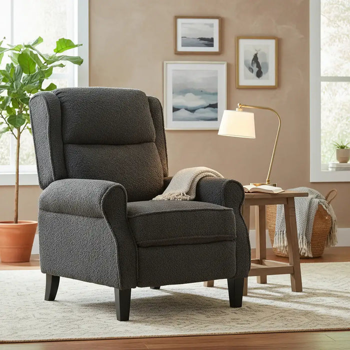 Gray armchair in a living room with decor elements