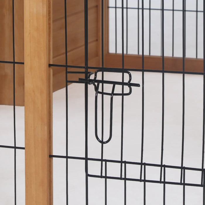 Black metal wire pet gate latch with wooden frame in indoor setting