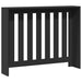 Black radiator cover with vertical slats on a white background