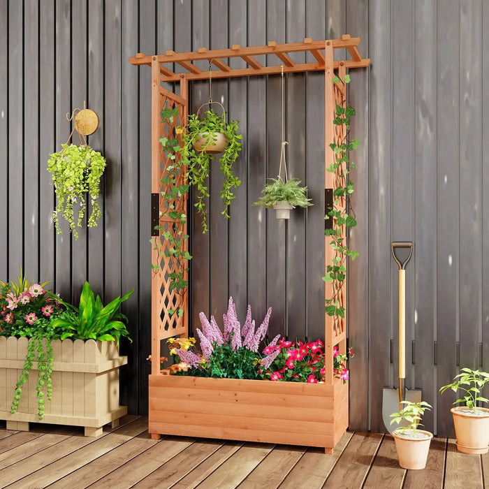 Wooden raised garden bed with trellis supporting hanging plants and climbing vines, surrounded by potted flowers and gardening shovel
