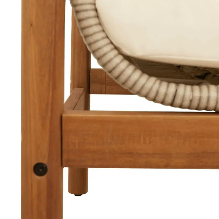 Close-up of rattan garden bench with acacia wood frame and cream white cushion