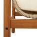 Close-up of rattan garden bench with acacia wood frame and cream white cushion