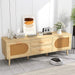 Natural wood rattan TV stand with drawers and cabinets in modern living room, decorated with books and flowers