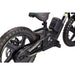Close-up of black 16-inch kids electric balance bike with textured wheels and battery pack