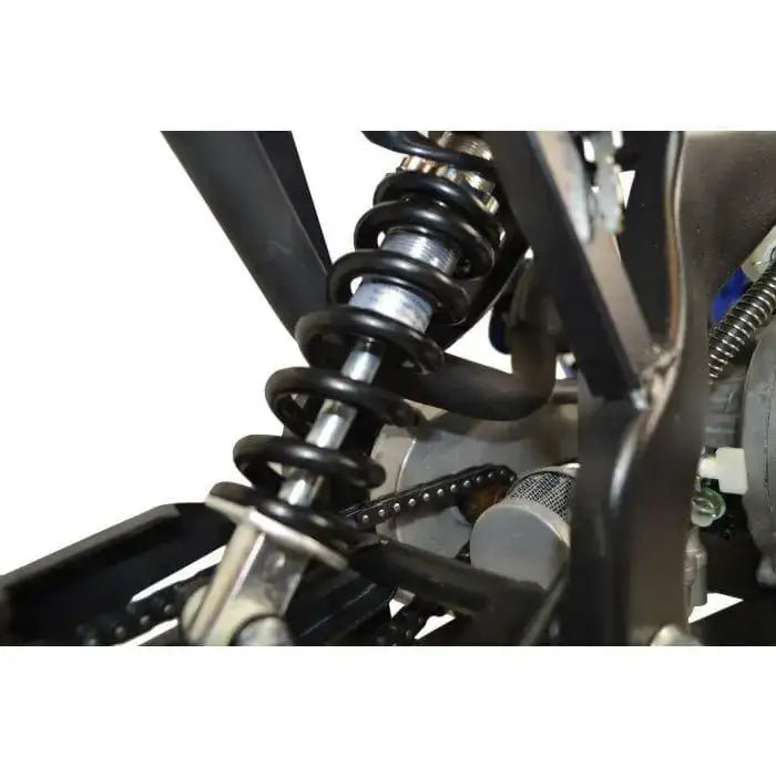 Close-up of mini dirt bike rear shock absorber and chain mechanism