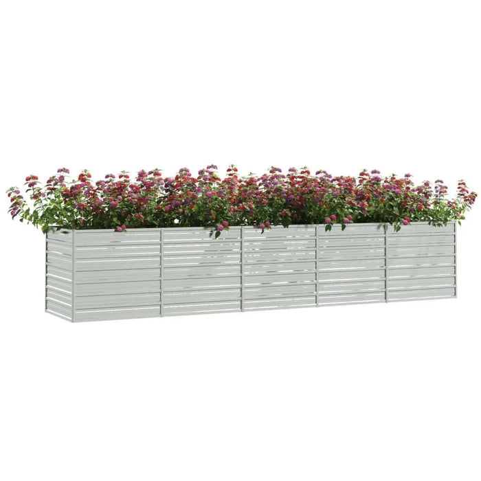 Rectangular galvanized steel garden raised bed filled with blooming pink flowers