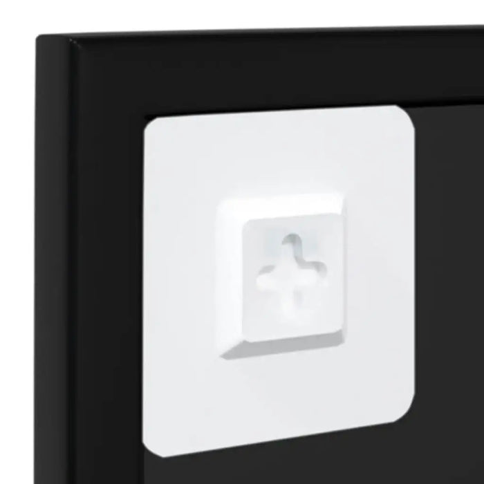 White square light switch cover with a gray arrow on a black background