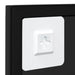 White square light switch cover with a gray arrow on a black background