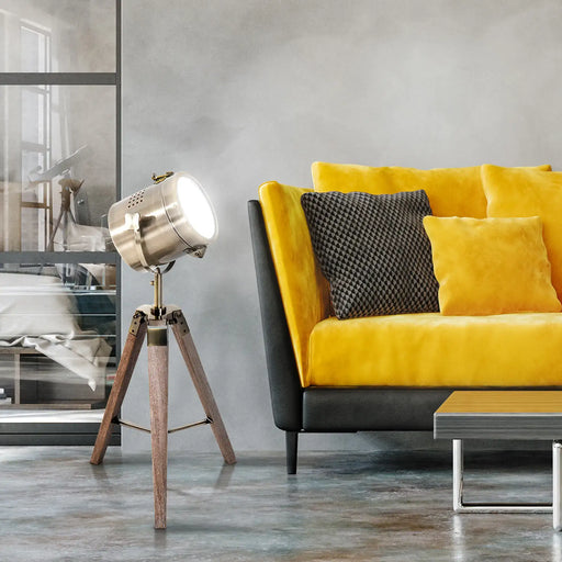 Yellow sofa with decorative pillows in a modern living room setting.