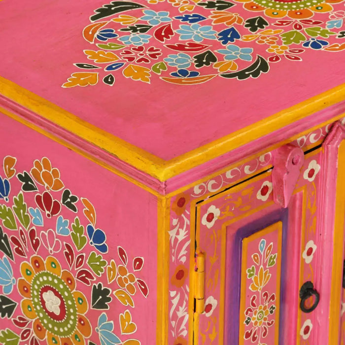 Close-up of a pink hand-painted retro mango wood TV cabinet with floral patterns and yellow accents