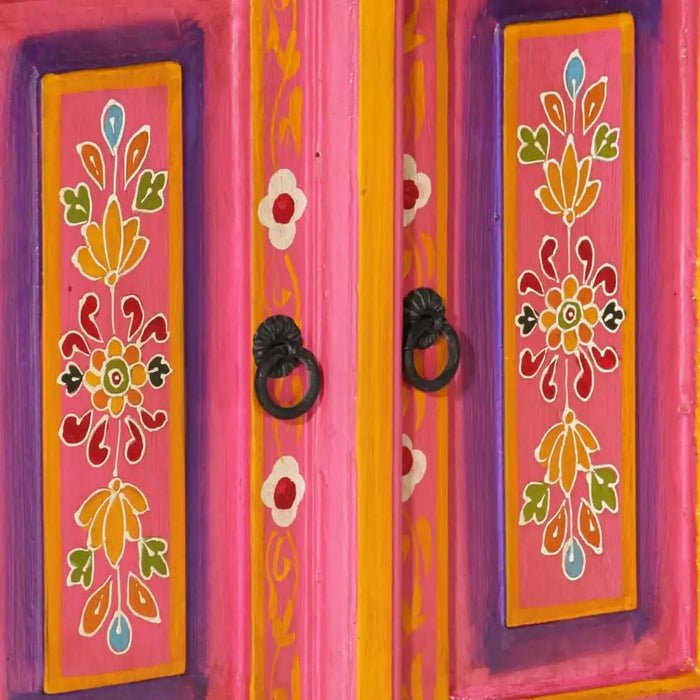 Close-up of retro wooden TV cabinet with hand-painted floral designs in pink, purple, and yellow