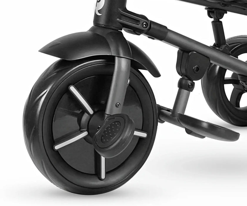 Close-up of a black children's bike wheel on a white background