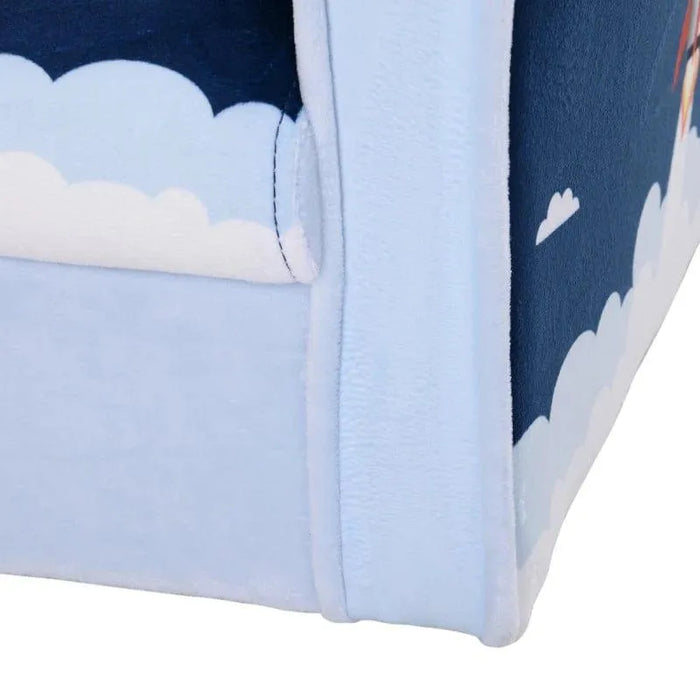 Close-up of blue kids armchair with rocket and cloud design, soft fabric upholstery