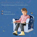Child sitting on multicolour rocket kids armchair, reading, with starry blue background.