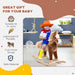 Smiling child in cowboy outfit riding brown plush rocking horse toy in modern playroom