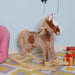 Brown plush rocking horse with saddle on geometric rug in a children's room