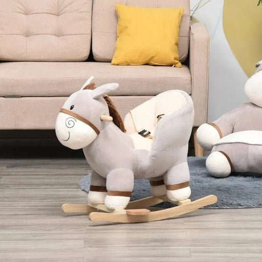 Grey donkey rocking horse for toddlers with safety seat on wooden base in living room
