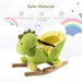 Green dinosaur plush rocking horse for toddlers with wooden base and seat belt.