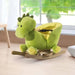 Green dinosaur plush rocking horse with wood frame in a sunlit room