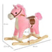 Pink and white plush rocking horse toy with brown saddle, wooden rockers, and size measurements