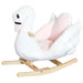 White and pink plush swan rocking horse with wooden base and handles, children's toy