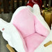 Plush pink and white swan rocking horse seat with soft cushion and wooden rockers