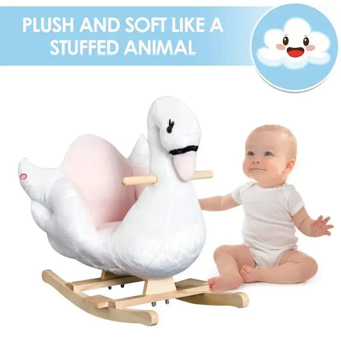 Baby next to plush white swan rocking horse with wooden base and pink seat