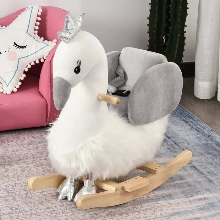 White and grey plush swan rocking horse with crown and safety seat in a cozy kids room
