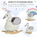 White and grey plush swan rocking horse with crown, wooden base, child seat, rainbows background
