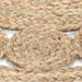 Close-up of braided natural fiber rope on a white background