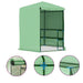 Green walk-in greenhouse with shelves, mesh cover, and close-up frame details