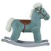 Blue plush rocking horse toy with white mane and tail, brown saddle, on gray rockers
