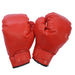Pair of red boxing gloves with velcro straps isolated on white background