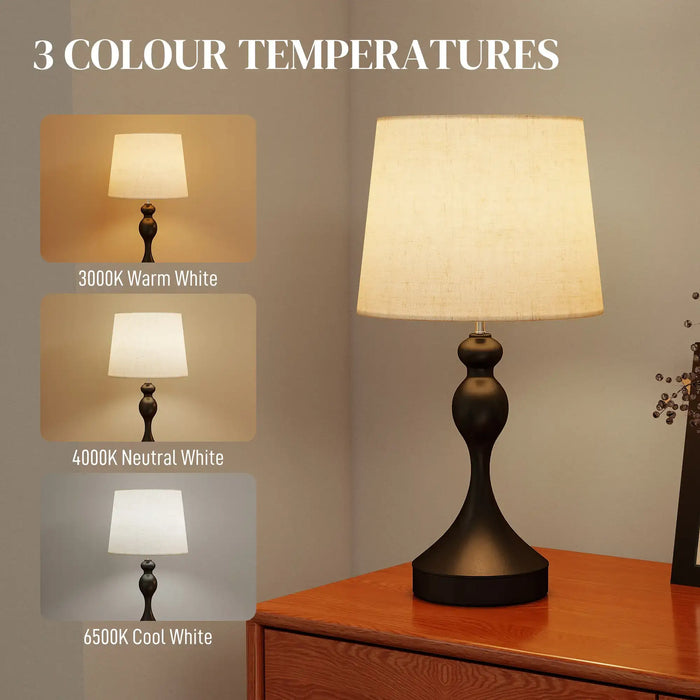 Table lamp with three color temperature options displayed on a wooden surface.