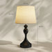 Table lamp with dimensions indicated on a beige background