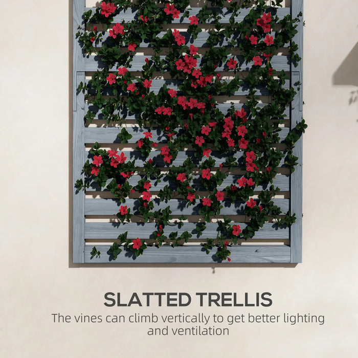 Grey wooden slatted wall-mounted trellis with green vines and red flowers climbing vertically outdoors