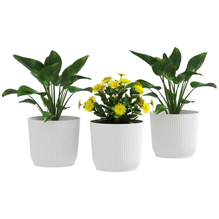 Set of three white stackable plastic plant pots containing green foliage plants and yellow flowers for indoor/outdoor use