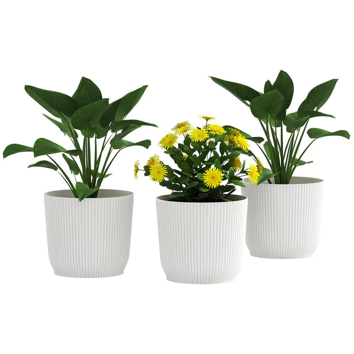 Set of 3 white ribbed stackable plastic plant pots with green leafy plants and yellow flowers