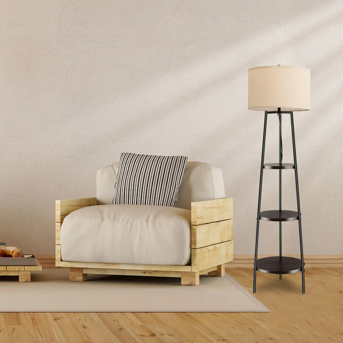 Wooden armchair with a striped pillow and a floor lamp in a room with wooden flooring and beige walls.
