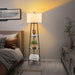 Tall floor lamp with shelves in a bedroom setting