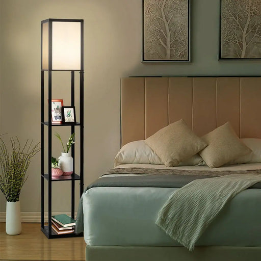 Bedroom with a bed, floor lamp, and wall art