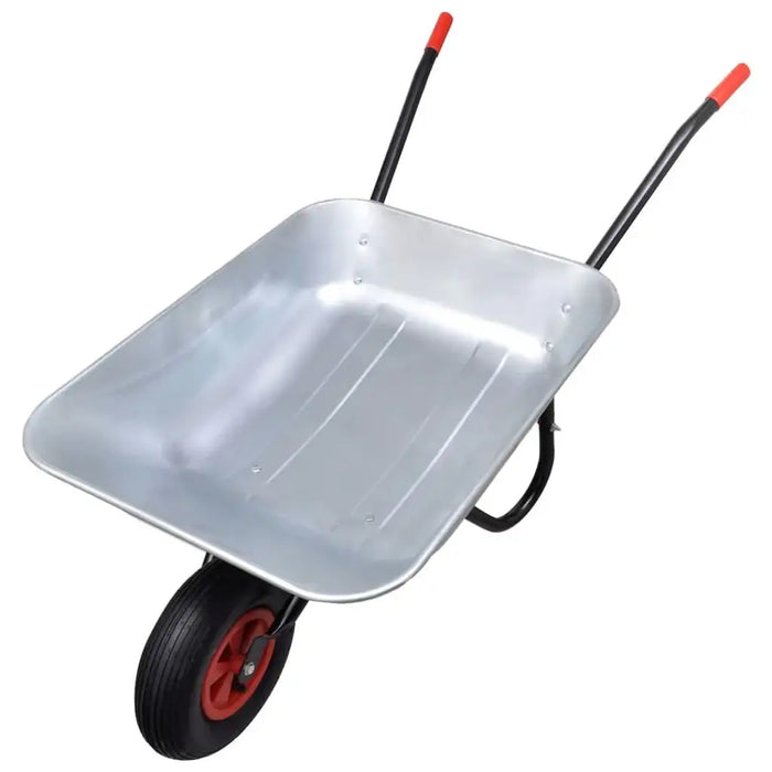 Galvanised steel wheelbarrow with single pneumatic tire and red handles on white background